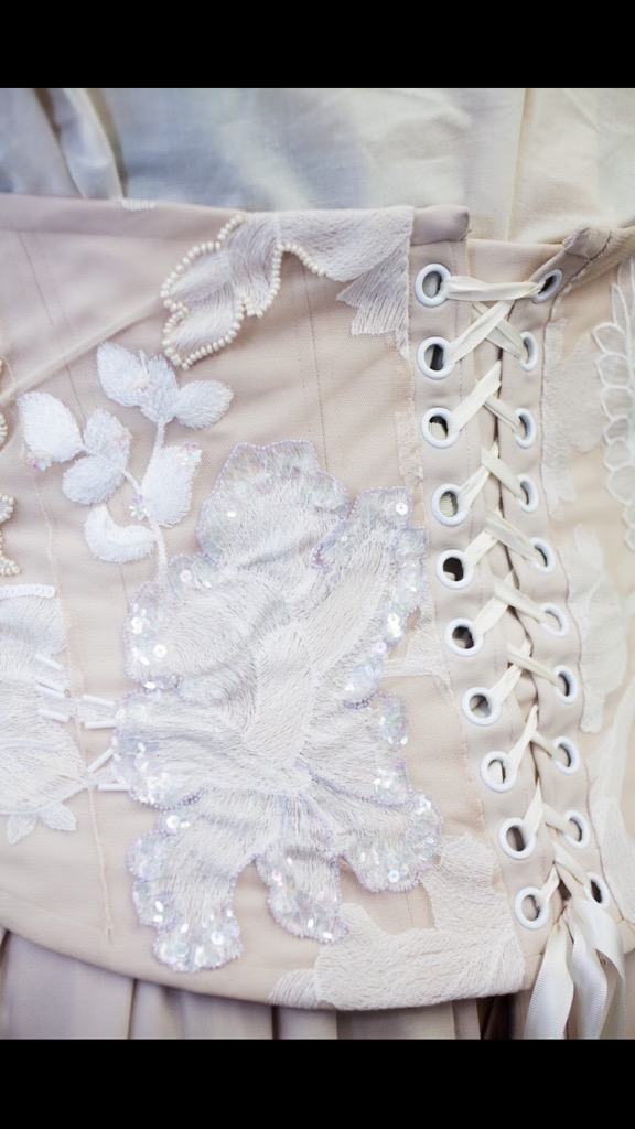 Closeup shot of embroidery on a corset back.